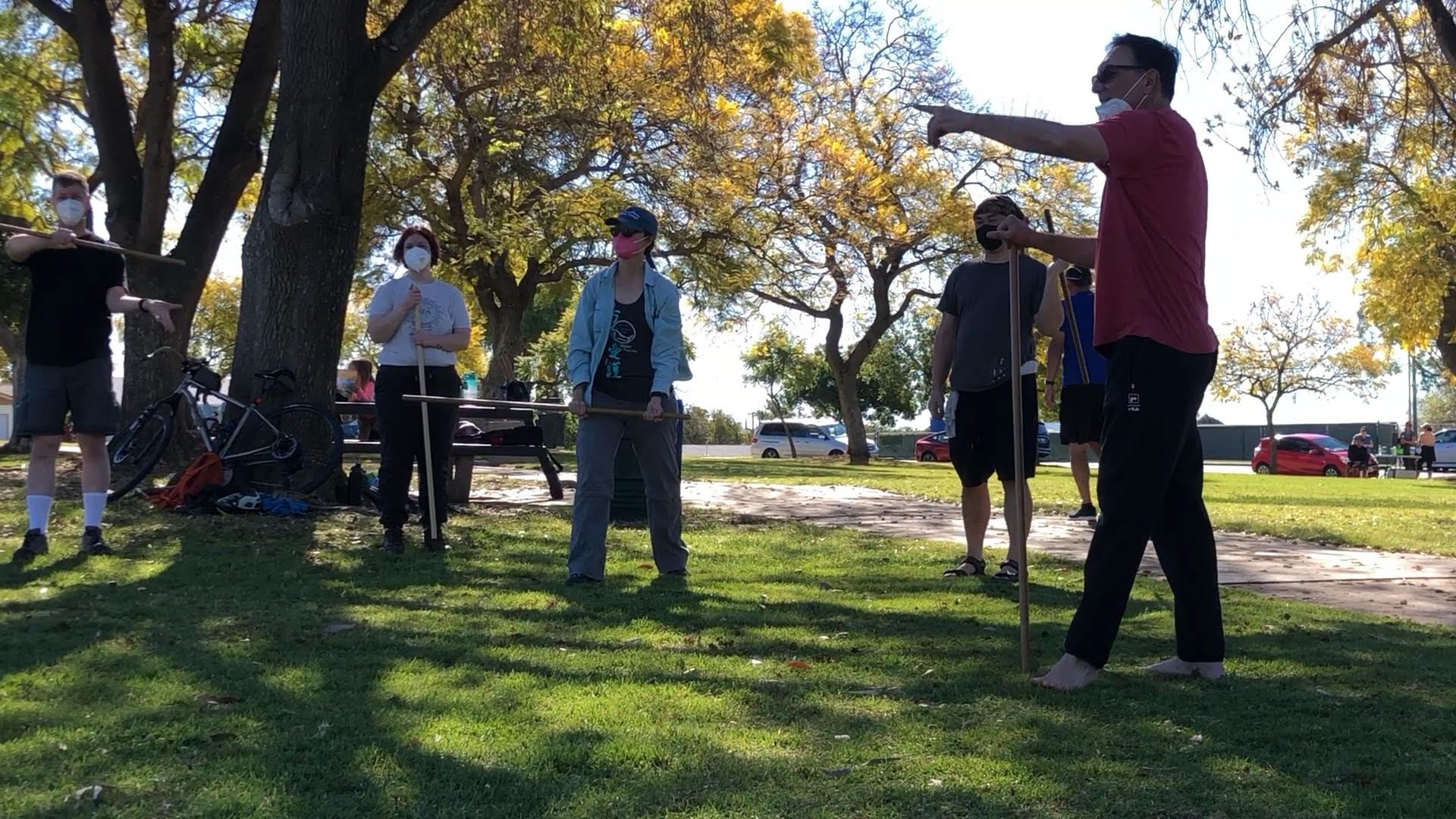 Aikido training in the park. Dave Goldberg Sensei discussing a technique
